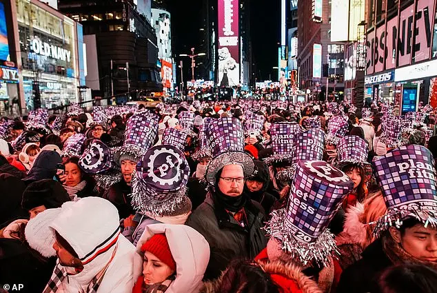 Thousands Gather in Times Square for New Year's Eve Celebration as 2025 Begins
