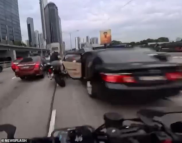 Chaos Erupts on Malaysian Motorway as Two-Year-Old Flings Car Door Open, Injuring Motorcyclist