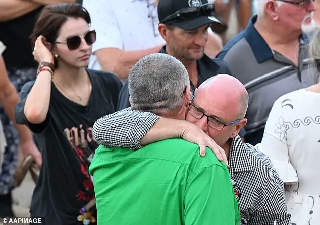Shark attack victim's father pleads with people not to stay away from the beach