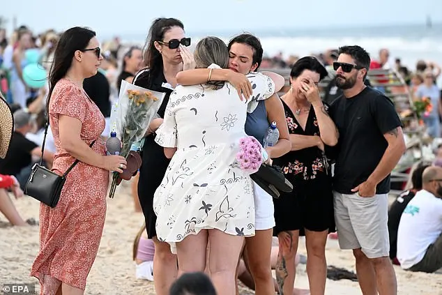 Shark attack victim's father pleads with people not to stay away from the beach