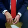 Photograph of President Donald Trump with Mysterious Blue Object Sparks Public Speculation and Conspiracy Theories